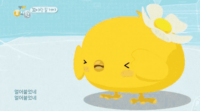 a yellow chicken with a flower on its head