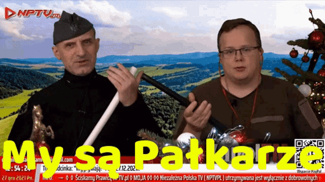 two men are standing in front of a screen that says mysa patkarz on it