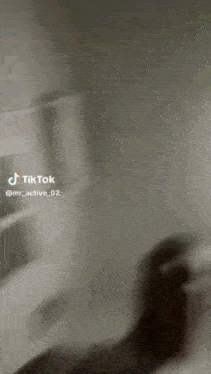 a tiktok video of a person taking something out of a refrigerator