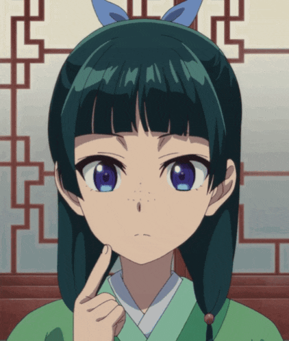 a girl with a blue bow in her hair is pointing her finger