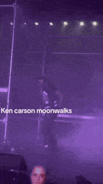 a man is dancing on a stage with the words ken carson moonwalks written on the bottom