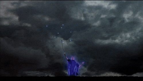 a blue lightning bolt strikes a person in the dark