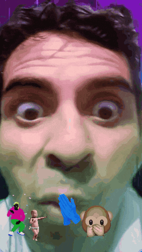a close up of a man 's face with a monkey and a baby behind him