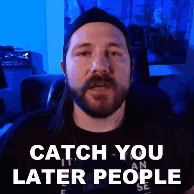 a man with long hair and a beard is saying catch you later people