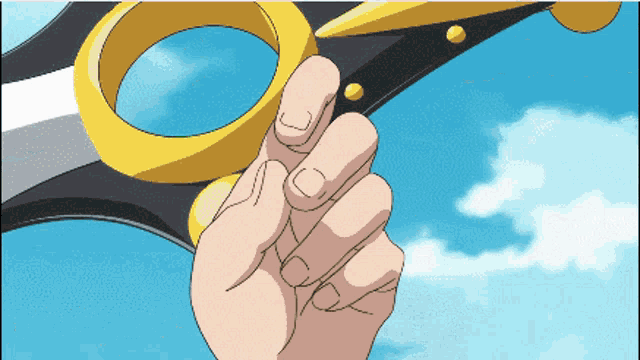 a person is holding a pair of scissors in their hand