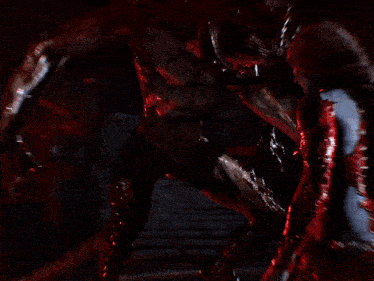 a woman is laying on the ground with blood coming out of her face