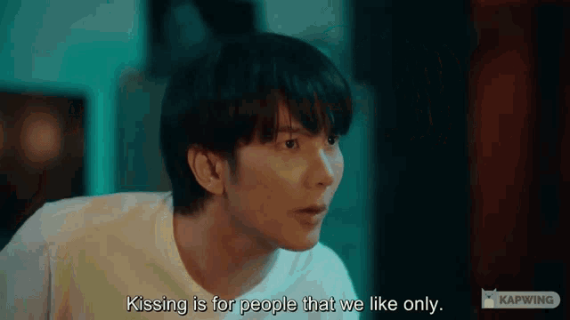 a man in a white shirt is saying kissing is for people that we like only .