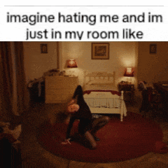 a woman is kneeling on the floor in a bedroom with a caption that says imagine hating me and im just in my room like