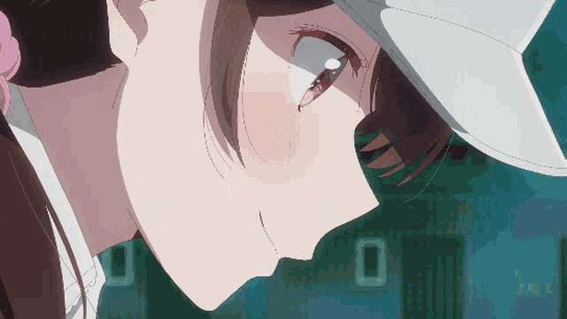 a close up of a girl 's face with a hat on