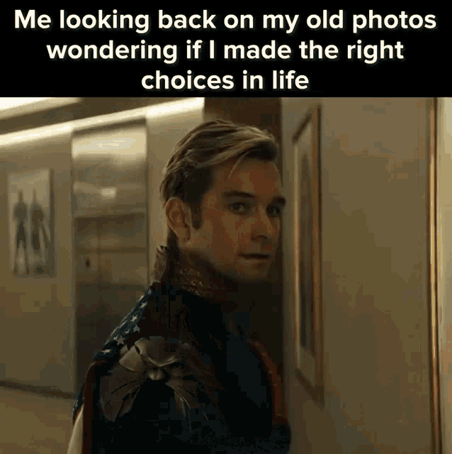 a man in a superhero outfit is looking back on his old photos wondering if he made the right choices in life .