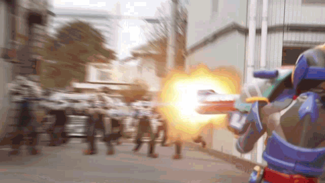 a robot is shooting a gun at a group of people
