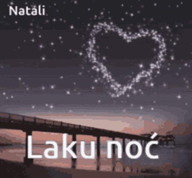 a picture of a bridge with a heart made of stars and the words laku noc