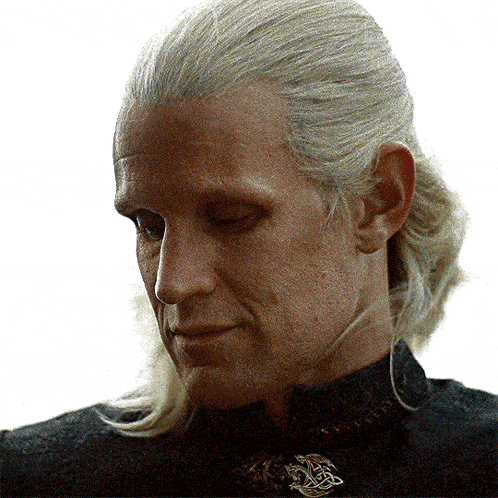a close up of a man with a ponytail