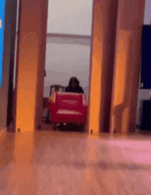 a blurred image of a person sitting in a chair