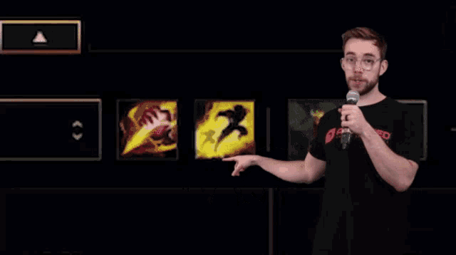 a man holding a microphone in front of a screen that says it 's flash on it