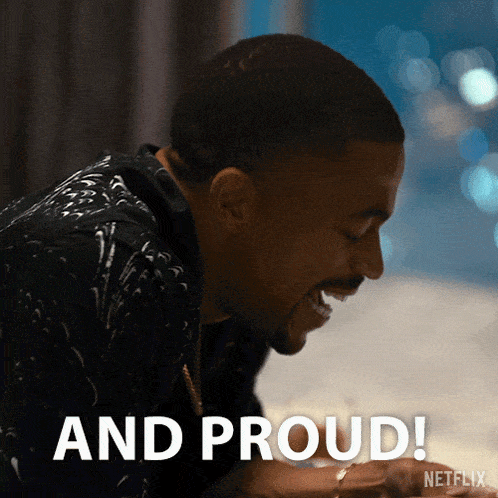 a man is laughing with the words " and proud " written below him