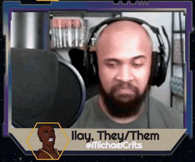 a man with a beard wearing headphones says illay they / them