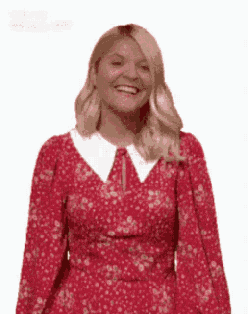 a woman in a red dress with a white collar is smiling .