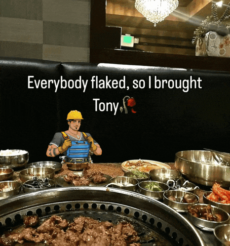 a sign that says everybody flaked so i brought tony sits above a table full of food