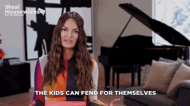 a woman says the kids can fend for themselves while standing in front of a piano