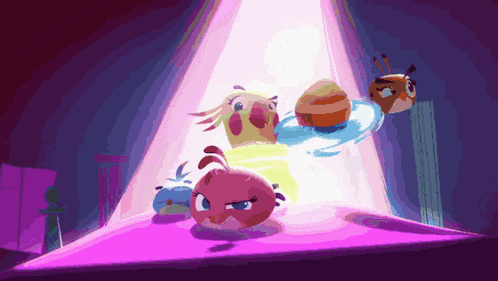 a group of angry birds are standing in a spotlight