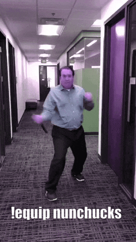 a man is dancing in a hallway with the words lequip nunchucks written above him