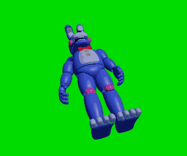 a blue stuffed animal with a star on its chest is laying on a green screen