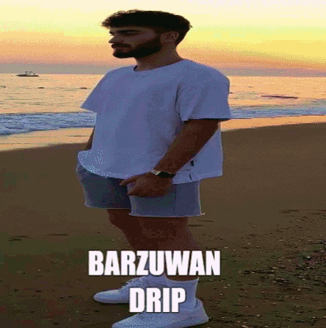 a man standing on a beach with barzuwan drip written on the bottom