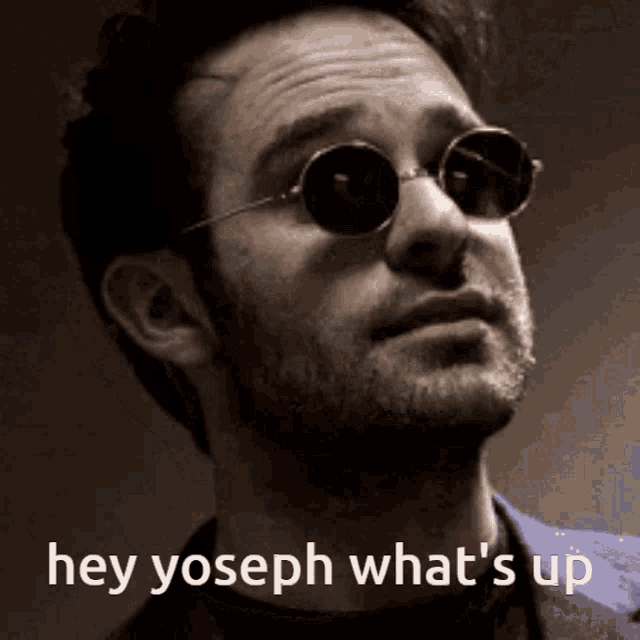 a close up of a man wearing sunglasses with the words hey joseph what 's up below him