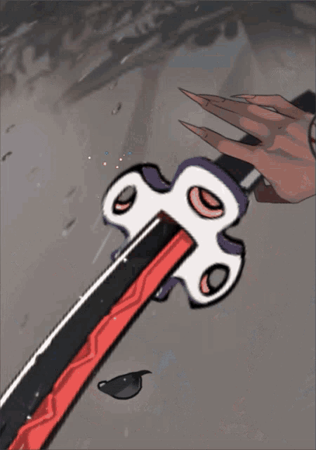 a red and black sword with a white handle