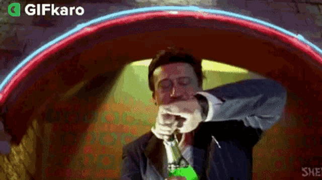a man in a suit and tie is smoking a pipe in a tunnel .
