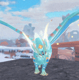 a blue dragon with wings is standing on a rocky surface