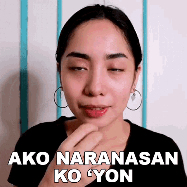 a woman with her eyes closed is wearing hoop earrings and has the words ako naranasan ko yon on her face