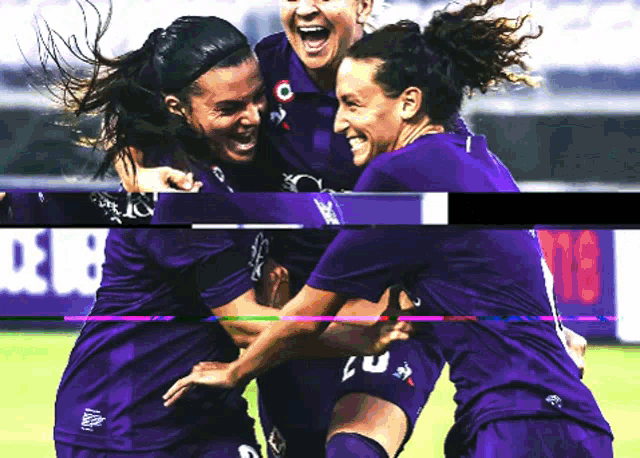 a group of female soccer players wearing purple jerseys with the number 20 on them