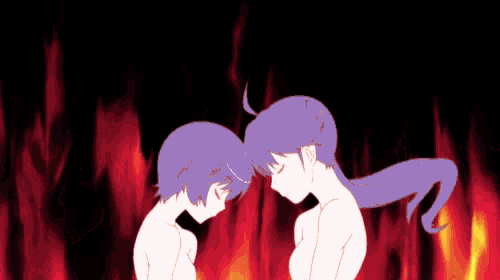a man and a woman are standing next to each other in front of a fire