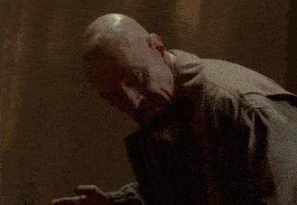 a person 's foot is standing on a wooden floor in a blurry photo .