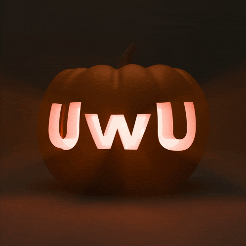 a pumpkin with the word uwu carved in it