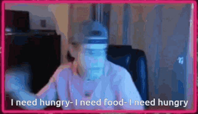 a man wearing a face shield says i need hungry i need food i need hungry .