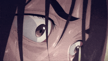 a close up of a person 's face with a tear coming out of their eye