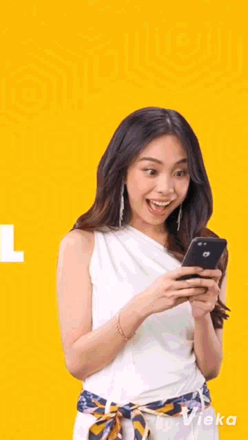 a woman in a denim jacket is smiling in front of a yellow background with the words mayn glo fans on it