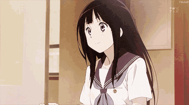 a girl with long black hair is smiling in front of a sign that says fujiya