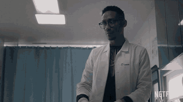 a man in a lab coat with the name smith on the back