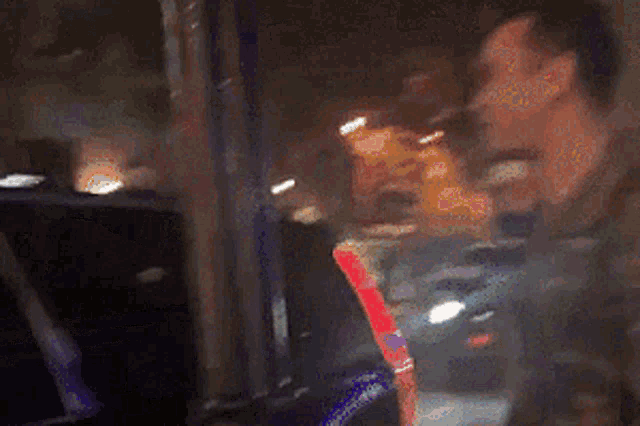 a blurred image of a man with the words shook barb written in yellow