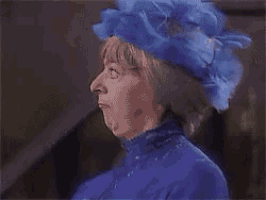 a woman wearing a blue hat with the words e voce satanas written below her
