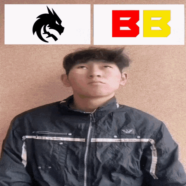 a man in a black jacket is standing in front of a sign that says bb