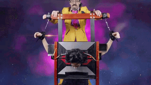 a person 's head is sticking out of a box with a red and silver triangle on it