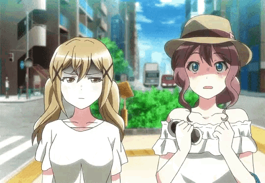 two anime girls standing next to each other on a street