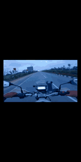 a video of a person riding a motorcycle is displayed on a phone screen