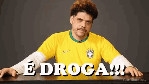 a man wearing a yellow nike shirt says e droga