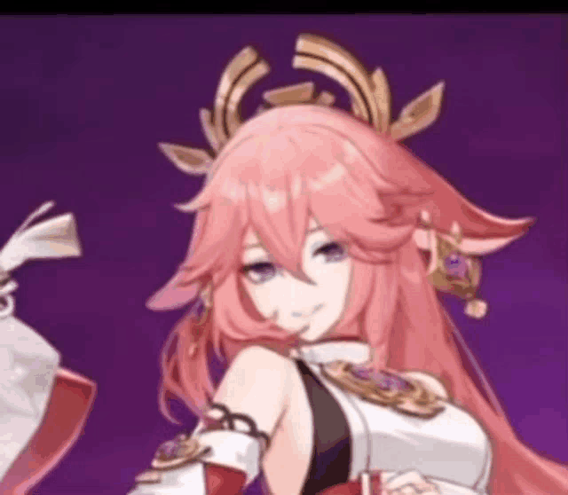 a girl with long pink hair and a crown on her head .